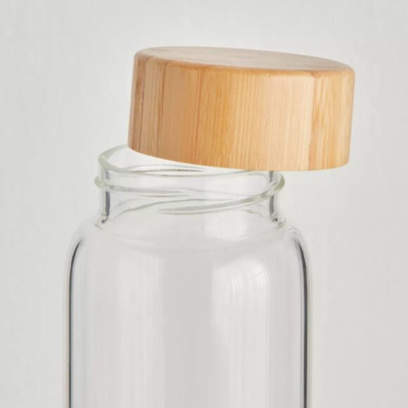 cylindrical glass bottle wooden lid califora
